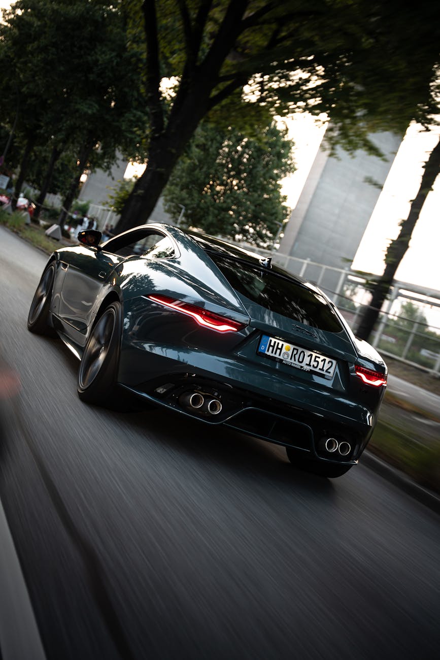 Dynamic shot of a sleek sports car speeding through Hamburg.